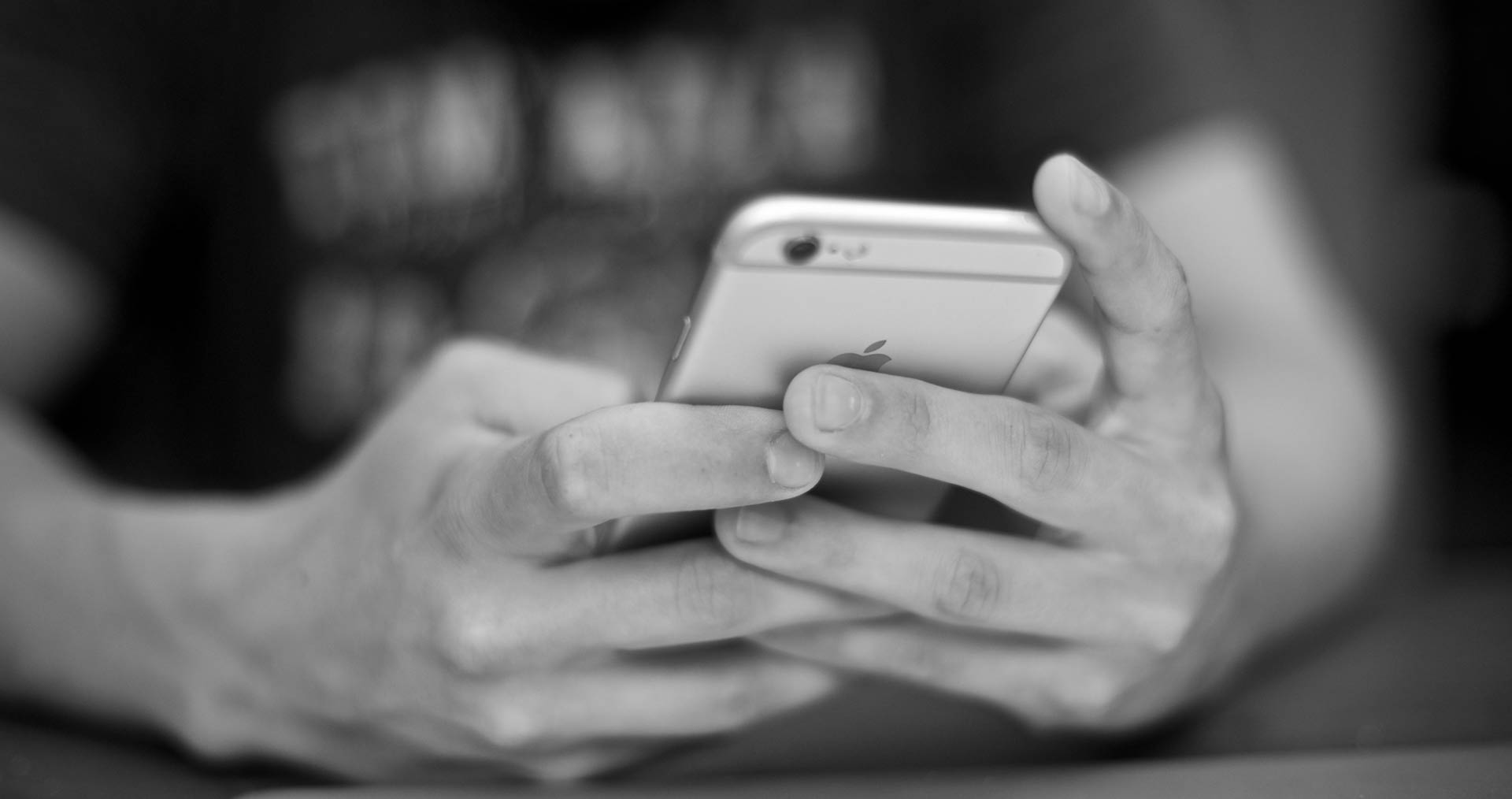 person holding phone - nexd blog - mobile ad viewability